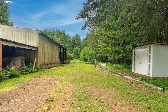 10303 SE Bull Run Rd, Corbett, OR 97019 - view of yard with an outbuilding and a wooded view