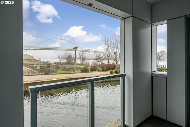 balcony featuring a water view