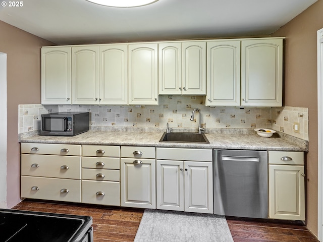 4887 S Elliott Prairie Rd, Woodburn, OR 97071 - kitchen featuring stainless steel dishwasher, tasteful backsplash, dark wood-style flooring, and light countertops