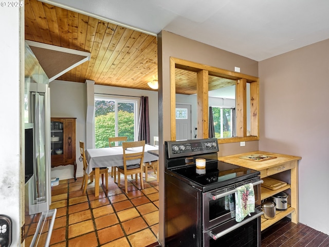 4887 S Elliott Prairie Rd, Woodburn, OR 97071 - kitchen featuring range with two ovens and wooden ceiling