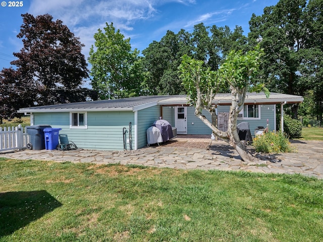 4887 S Elliott Prairie Rd, Woodburn, OR 97071 - rear view of house with a patio and a metal roof