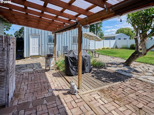 4887 S Elliott Prairie Rd, Woodburn, OR 97071 - fenced backyard with a grill, a patio, and a pergola