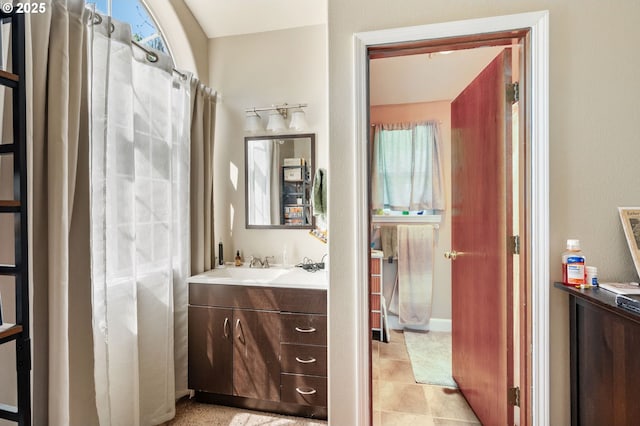 full bath with tile patterned flooring and vanity