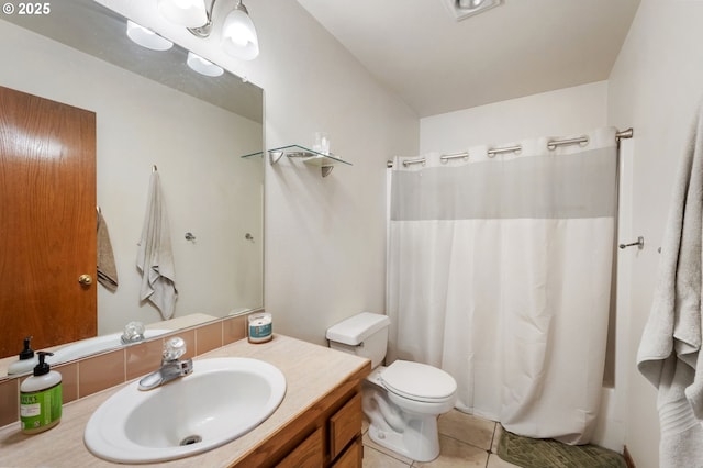 bathroom featuring tile patterned floors, toilet, and vanity