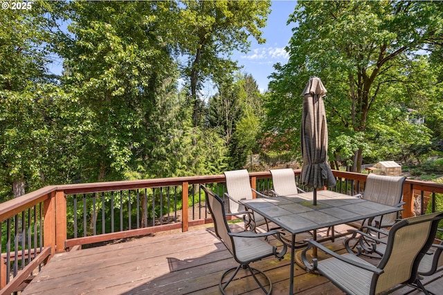 deck featuring outdoor dining area