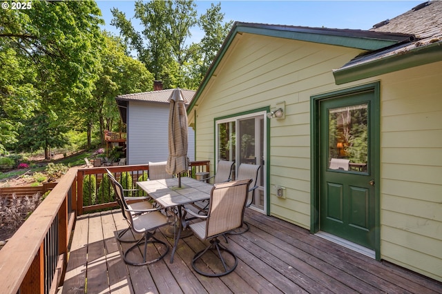 wooden deck with outdoor dining space