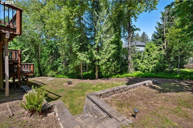 view of yard featuring a deck