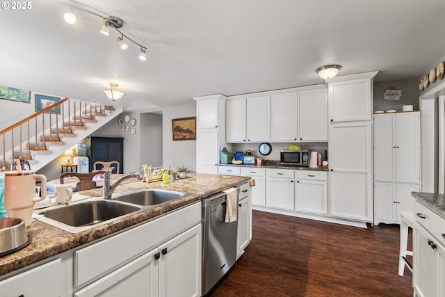1495 N Hemlock St, Coquille, OR 97423 - kitchen with appliances with stainless steel finishes, dark wood-style floors, and white cabinetry