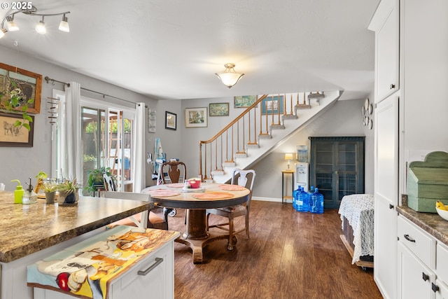 1495 N Hemlock St, Coquille, OR 97423 - dining room with dark wood-type flooring and stairs