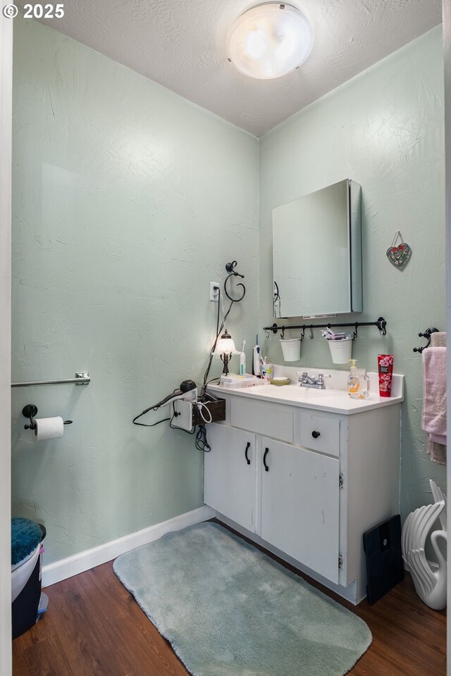 1495 N Hemlock St, Coquille, OR 97423 - bathroom with wood finished floors and vanity