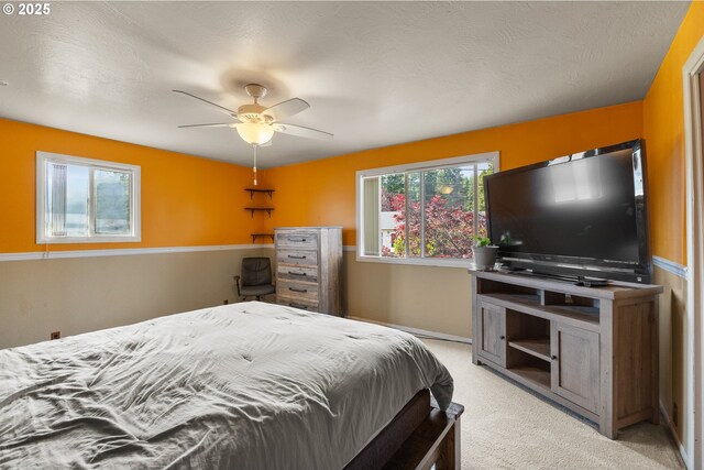 1495 N Hemlock St, Coquille, OR 97423 - bedroom with light colored carpet and a ceiling fan