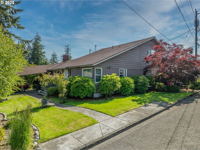 1495 N Hemlock St, Coquille, OR 97423 - view of front of property with a chimney and a front lawn