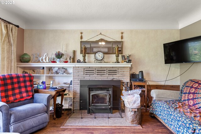 1495 N Hemlock St, Coquille, OR 97423 - living room featuring a wood stove and wood finished floors