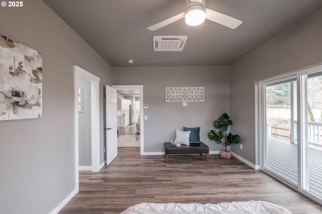 sitting room with hardwood / wood-style flooring and ceiling fan