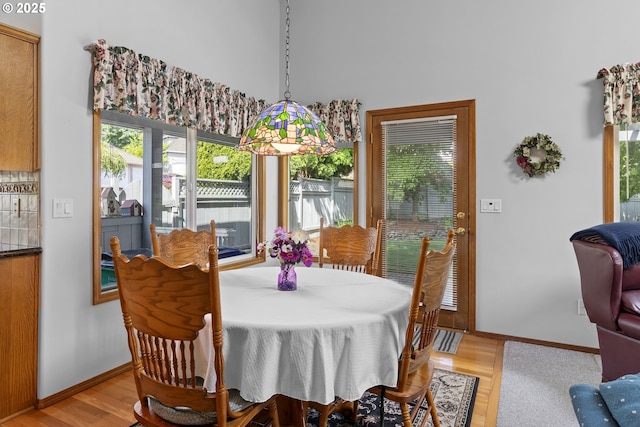 8346 SE 141st Ave, Portland, OR 97236 - dining space with light wood-style floors and a high ceiling