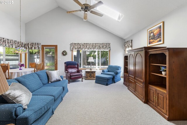 8346 SE 141st Ave, Portland, OR 97236 - carpeted living area with high vaulted ceiling, ceiling fan, and a skylight