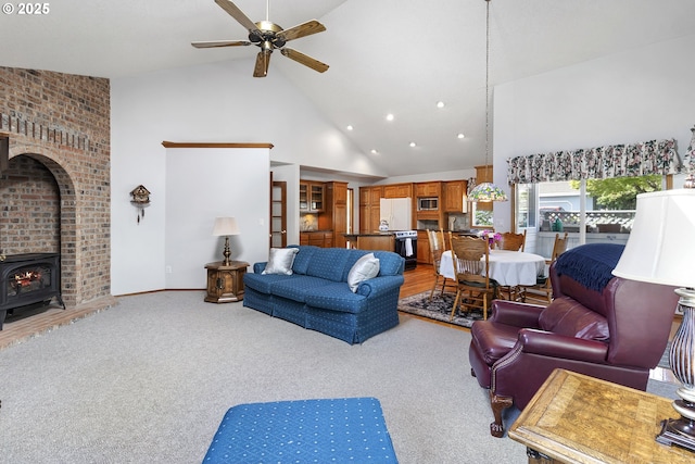 8346 SE 141st Ave, Portland, OR 97236 - living room with high vaulted ceiling, a ceiling fan, light colored carpet, a wood stove, and recessed lighting