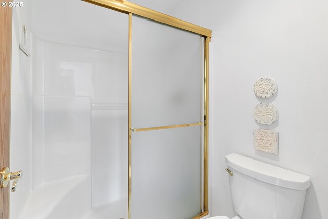 8346 SE 141st Ave, Portland, OR 97236 - bathroom featuring toilet and a shower with shower door
