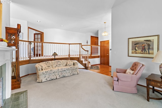 8346 SE 141st Ave, Portland, OR 97236 - living room featuring carpet flooring, stairs, a fireplace with flush hearth, and recessed lighting