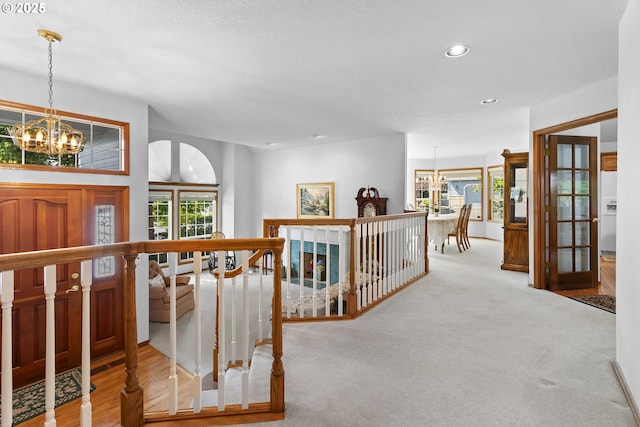 8346 SE 141st Ave, Portland, OR 97236 - hall featuring an upstairs landing, a chandelier, and recessed lighting