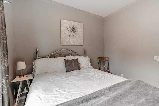 bedroom with crown molding