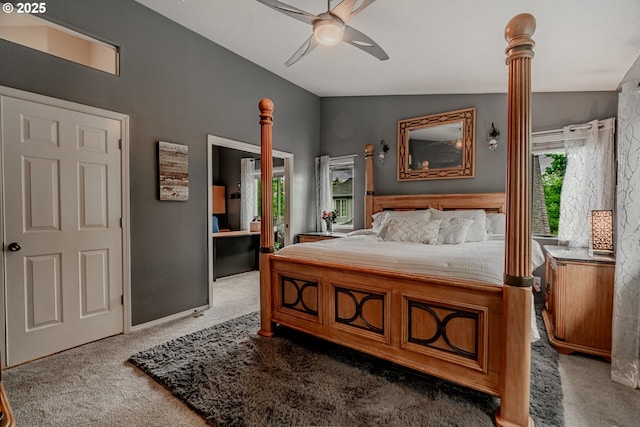 bedroom featuring carpet floors, lofted ceiling, and a ceiling fan