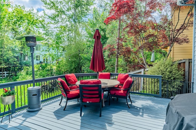 wooden deck featuring outdoor dining space