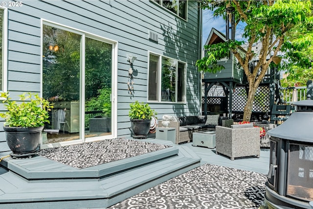 wooden deck with outdoor lounge area