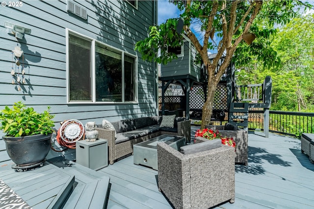 deck featuring outdoor lounge area