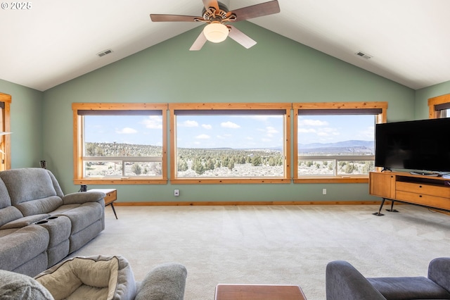 living room featuring lofted ceiling, visible vents, and plenty of natural light