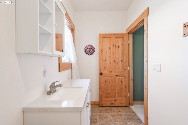 bathroom featuring vanity and baseboards