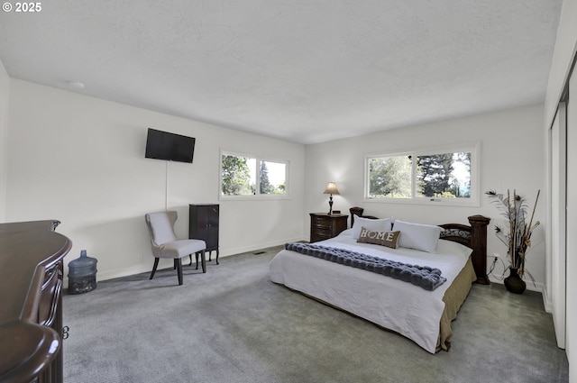 bedroom featuring baseboards and carpet floors