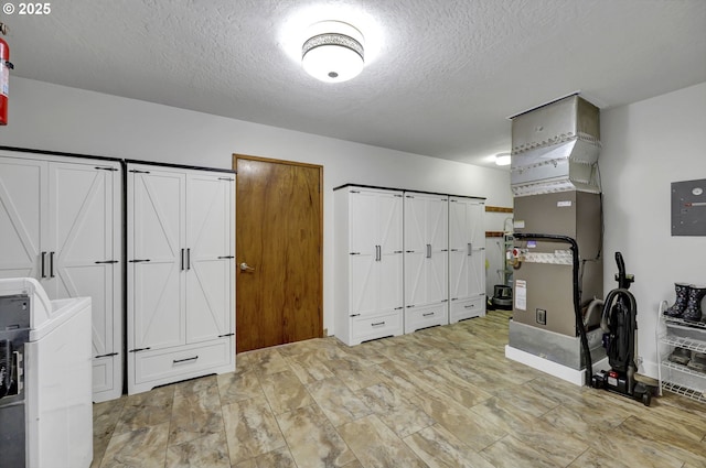 basement featuring a textured ceiling
