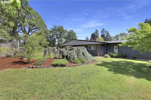 back of property with a lawn
