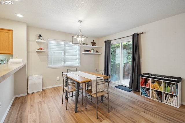 8028 SW Carol Ann Ct, Portland, OR 97224 - dining space with a chandelier, light wood-style flooring, baseboards, and recessed lighting
