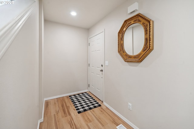 8028 SW Carol Ann Ct, Portland, OR 97224 - doorway to outside with wood finished floors, baseboards, and recessed lighting