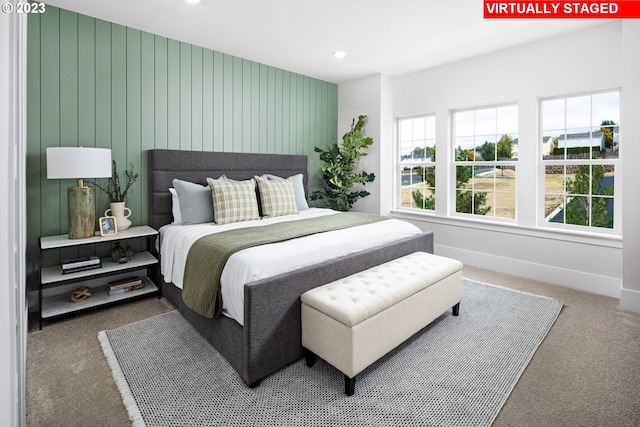 carpeted bedroom with baseboards