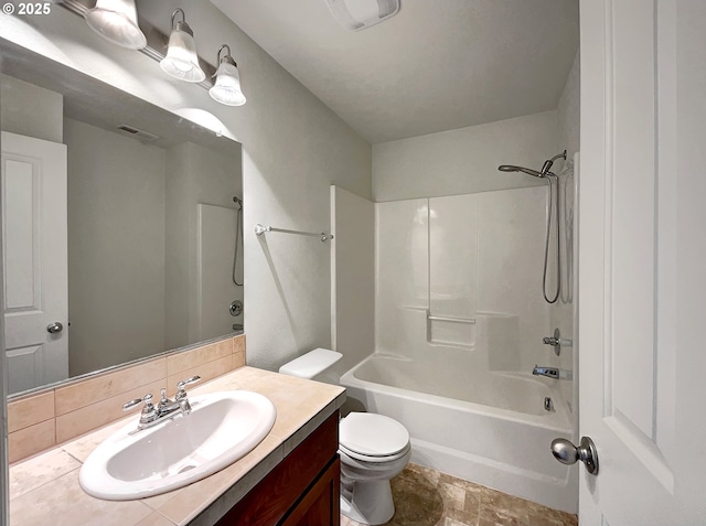 full bathroom featuring bathing tub / shower combination, toilet, visible vents, and vanity