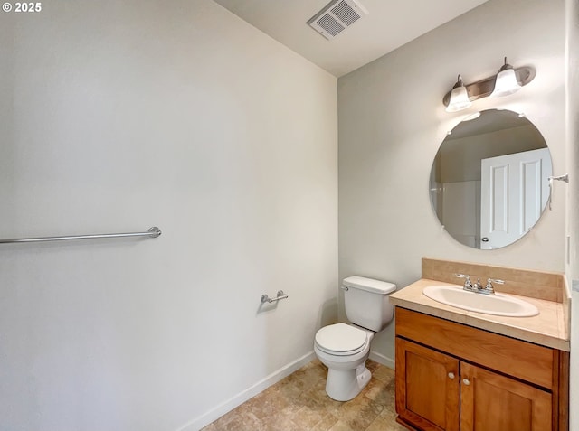 bathroom with visible vents, baseboards, toilet, and vanity