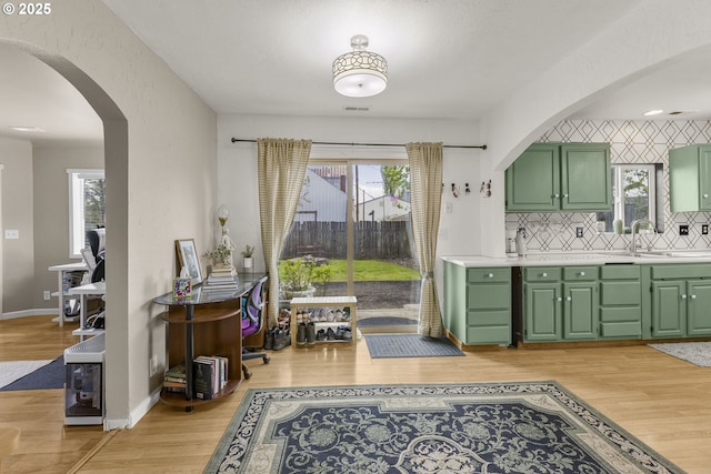 255 W F St, Halsey, OR 97348 - dining area with arched walkways, light wood-type flooring, healthy amount of natural light, and baseboards