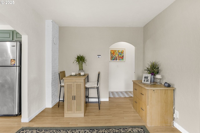 255 W F St, Halsey, OR 97348 - dining area with arched walkways, light wood-type flooring, and baseboards