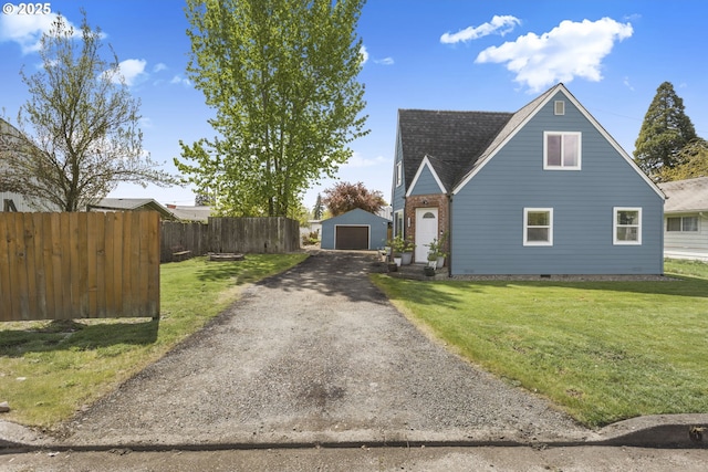 255 W F St, Halsey, OR 97348 - view of front of home featuring a garage, an outbuilding, a shingled roof, and crawl space
