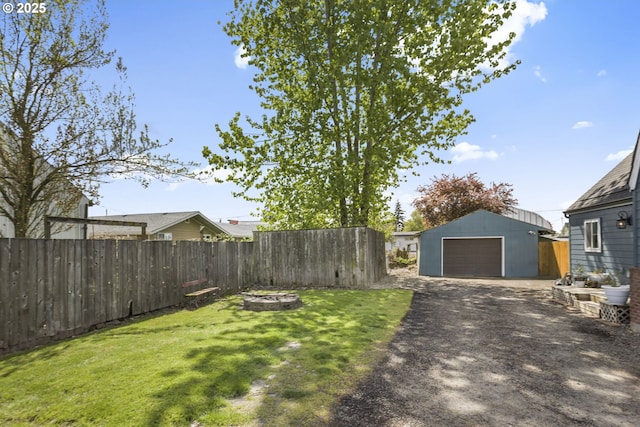 255 W F St, Halsey, OR 97348 - view of yard featuring asphalt driveway, an outbuilding, and a detached garage
