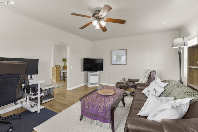 255 W F St, Halsey, OR 97348 - living room with arched walkways, a ceiling fan, wood finished floors, an office area, and baseboards