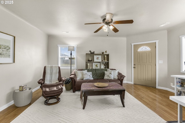 255 W F St, Halsey, OR 97348 - living area featuring a ceiling fan, wood finished floors, and baseboards