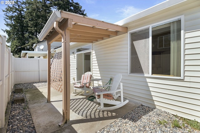 view of patio / terrace featuring fence