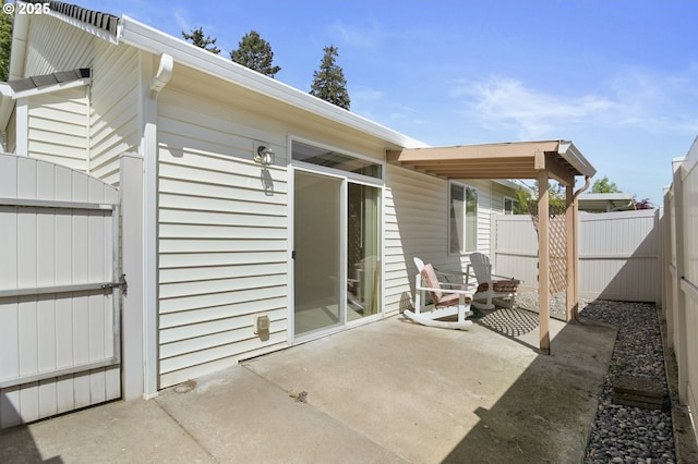 view of patio featuring fence