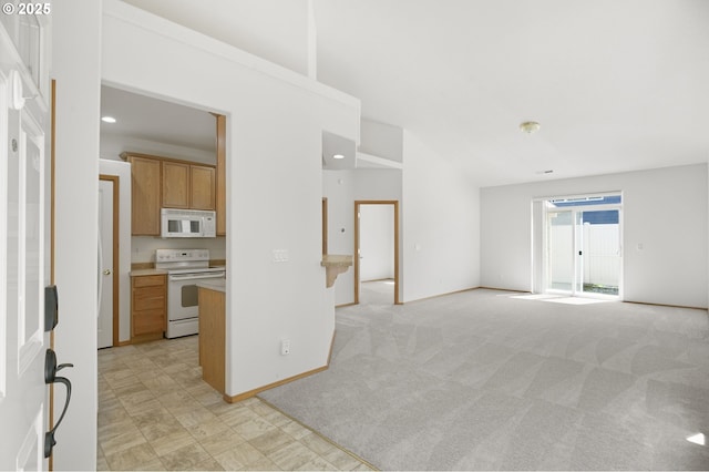 unfurnished living room featuring baseboards, light colored carpet, and lofted ceiling