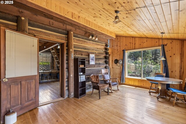 0 Hwy 395, Mount Vernon, OR 97865 - sitting room featuring wood ceiling, lofted ceiling, wooden walls, light wood finished floors, and log walls