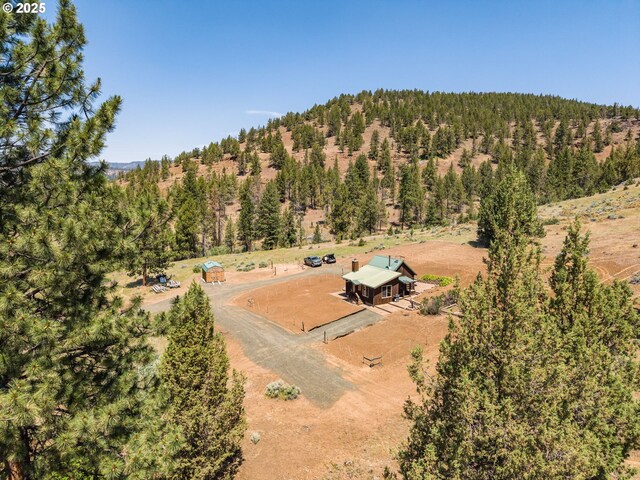 0 Hwy 395, Mount Vernon, OR 97865 - aerial view of sparsely populated area featuring a heavily wooded area and a mountainous background